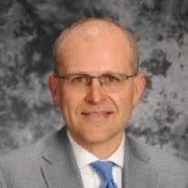 Portrait of EMWG co-chair Jason K. Hansen